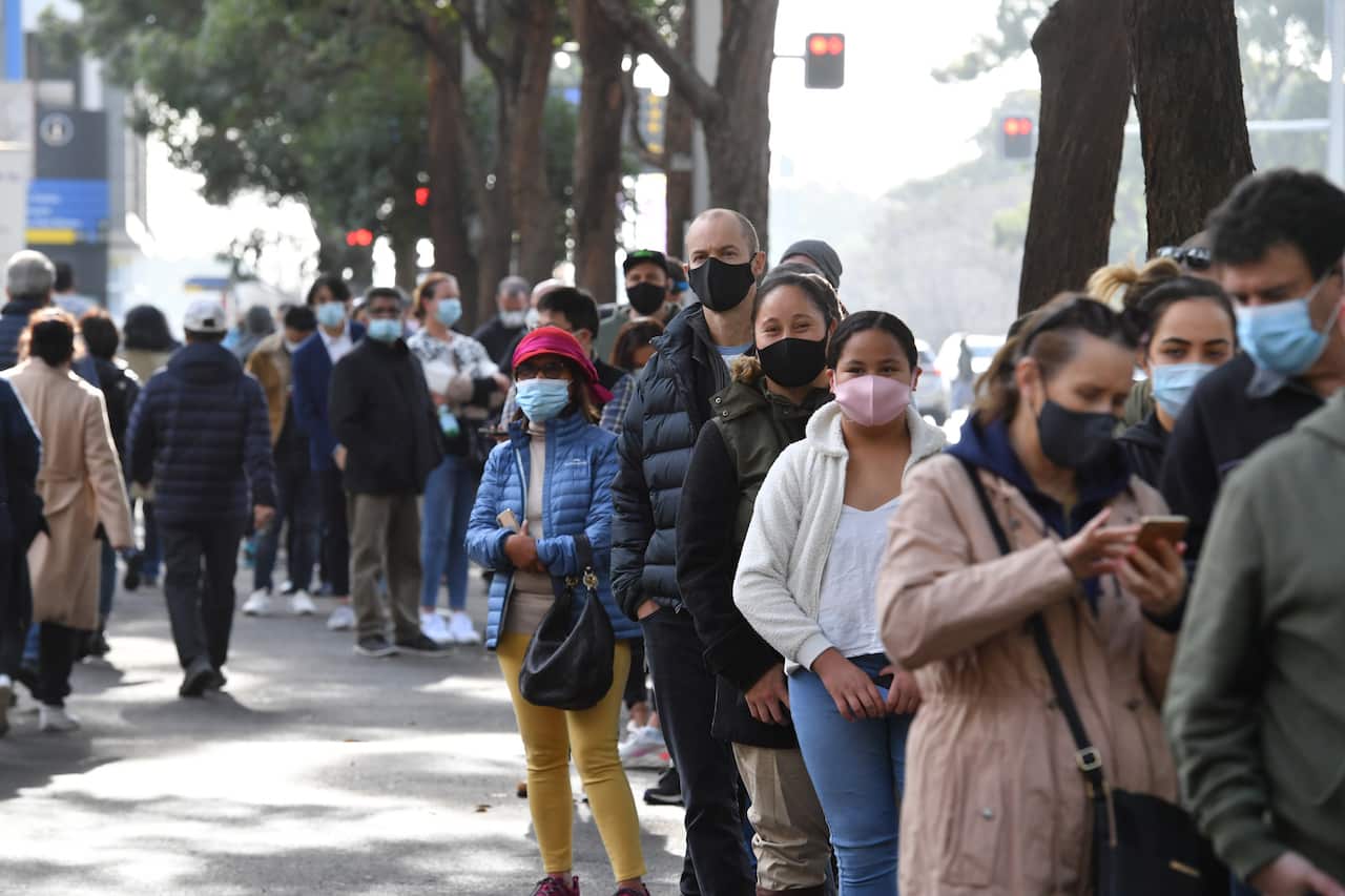 People are seen queued to receive their vaccination at the NSW Vaccine Centre at Homebush Olympic Park in Sydney, Thursday, July 1, 2021. 