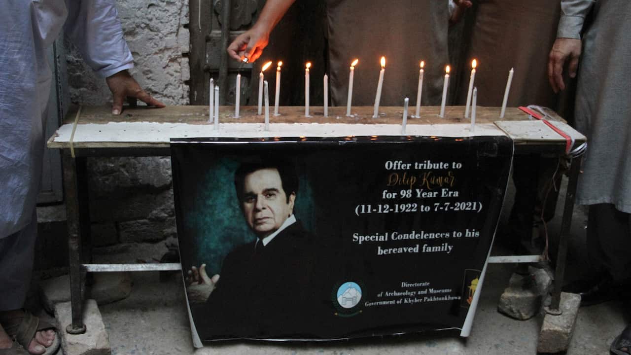 Local residents pay tributeto Dilip Kumar at outside the remains his of ancestral home, in Peshawar, Pakistan, Wednesday, July 7, 2021. 