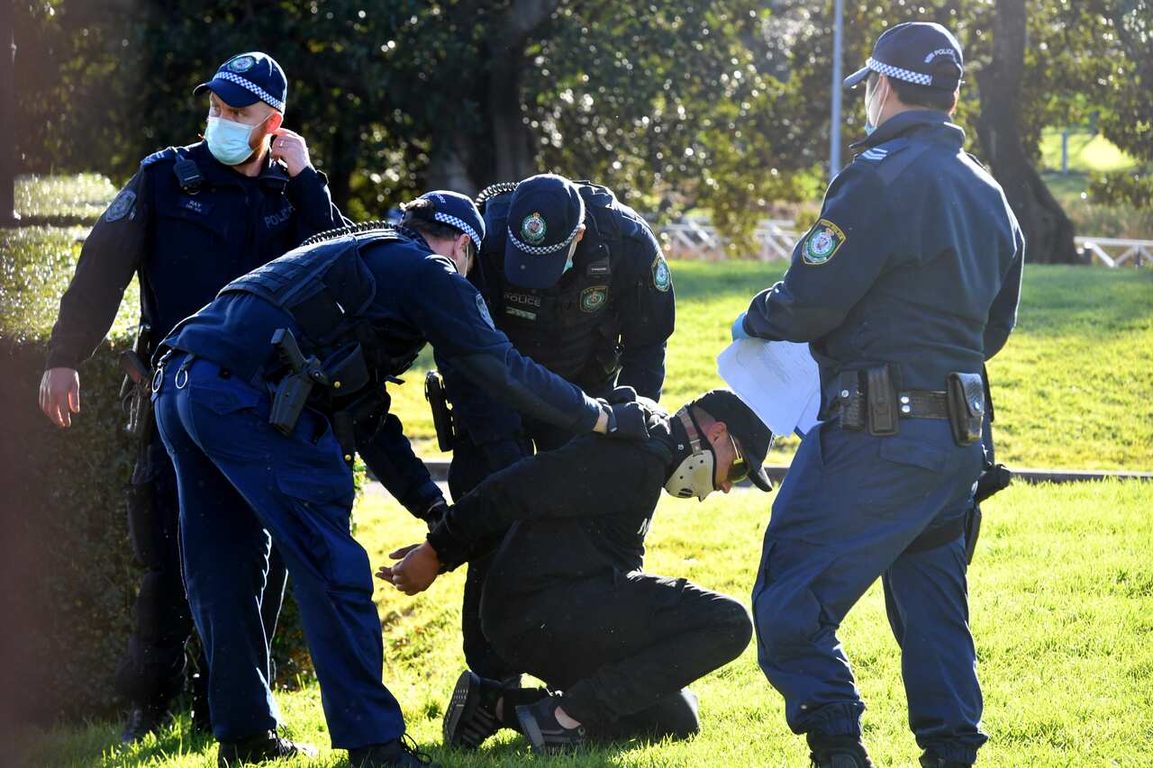 Police arrest protesters at Victoria Park in Glebe during the ‘World Wide Rally For Freedom’ anti-lockdown rally at Hyde Park in Sydney, Saturday, July 24, 2021. (AAP Image/Mick Tsikas) NO ARCHIVING