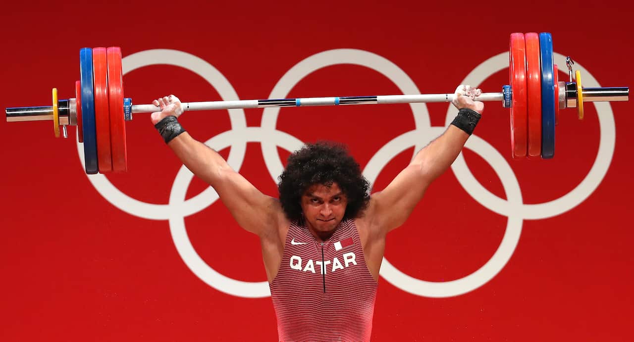 Fares Ibrahim Elbakh of Qatar competes in the men's 96kg category at the Tokyo Olympics.
