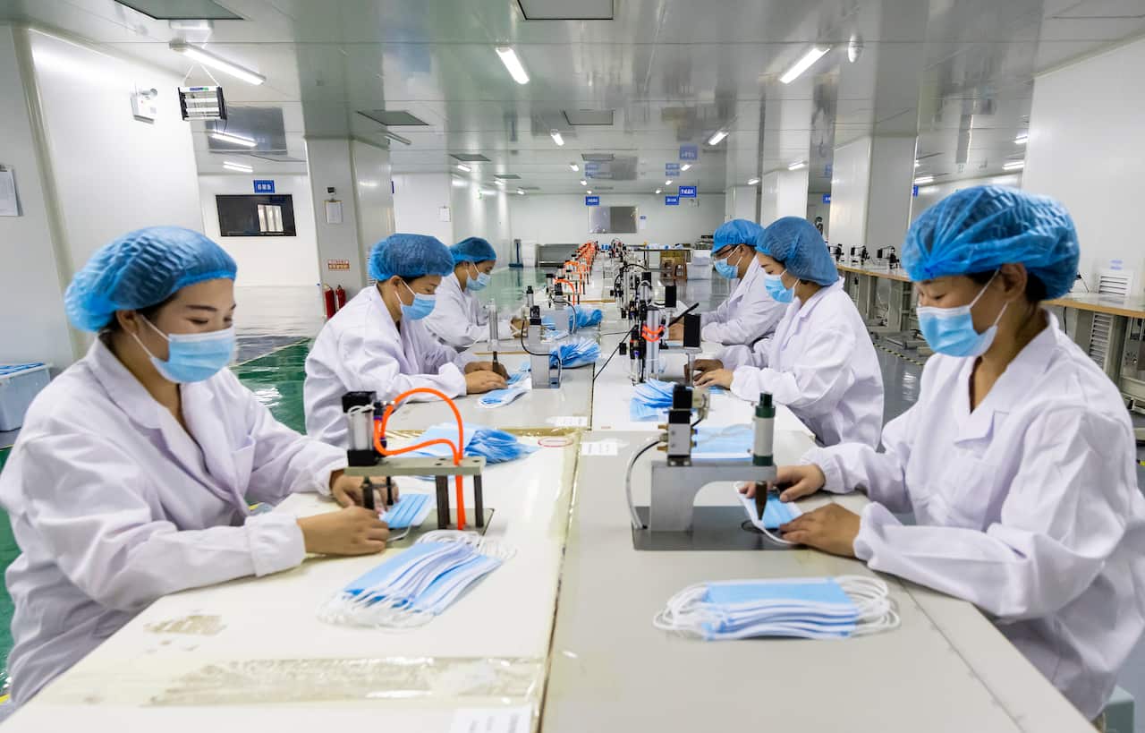 SUQIAN, CHINA - AUGUST 2, 2021 - Workers produce disposable surgical masks and other products at a workshop in Sihong County, Suqian City, East China's Jiangsu Province, Aug. 2, 2021 (Photo by Zhang Lianhua / Costfoto/Sipa USA)