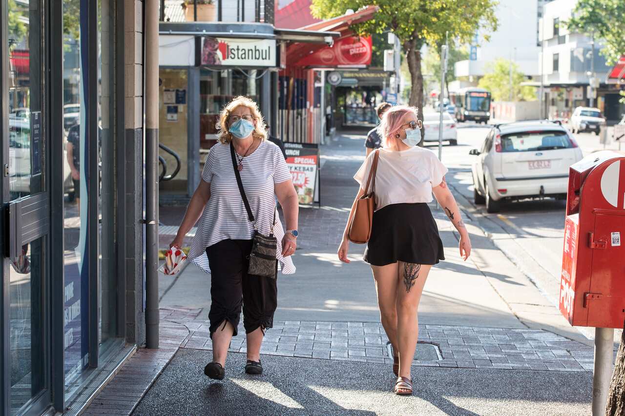 People are seen wearing masks, in Darwin, Monday, August 16, 2021.