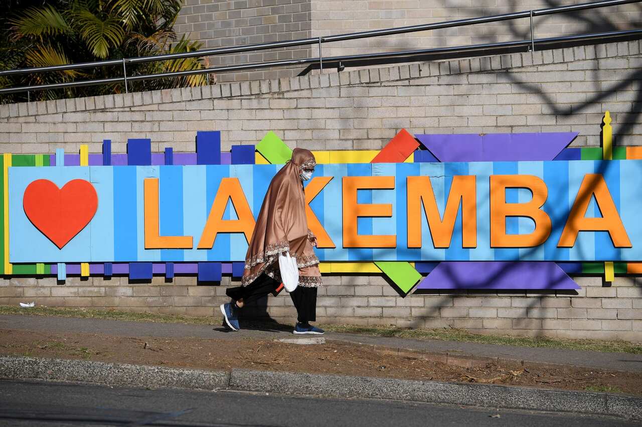 People are seen in Lakemba, south west of Sydney, Friday, August 20, 2021