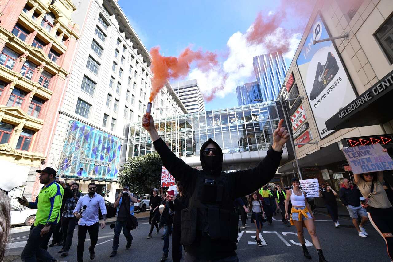 Protesters are seen during an anti-lockdown protest in the central business district of Melbourne