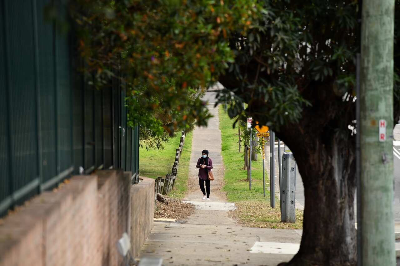 A woman seen wearing a face mask at Carlton in Sydney, Monday, August 23, 2021.