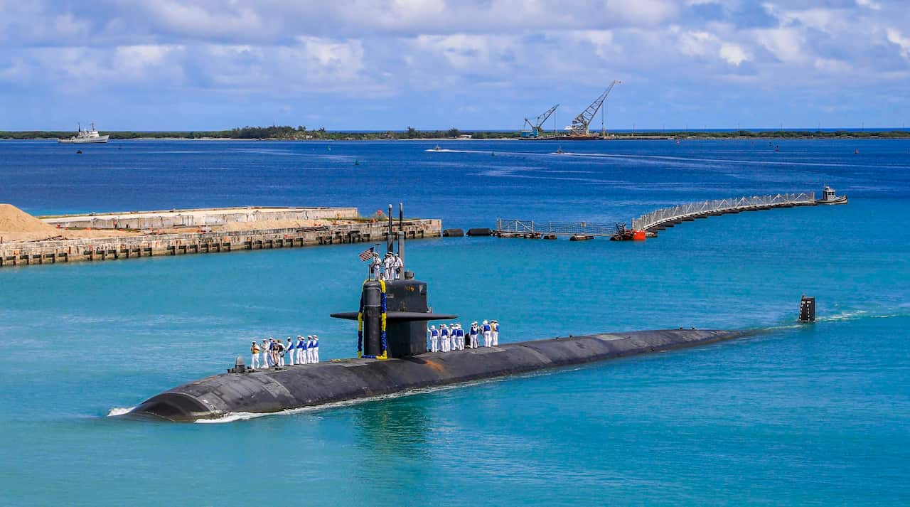 In this photo provided by U.S. Navy, the Los Angeles-class fast attack submarine USS Oklahoma City (SSN 723) returns to U.S. Naval Base in Guam, Aug. 19, 2021. Australia's Prime Minister Scott Morrison on Friday, Sept. 17, rejected Chinese criticism of Au