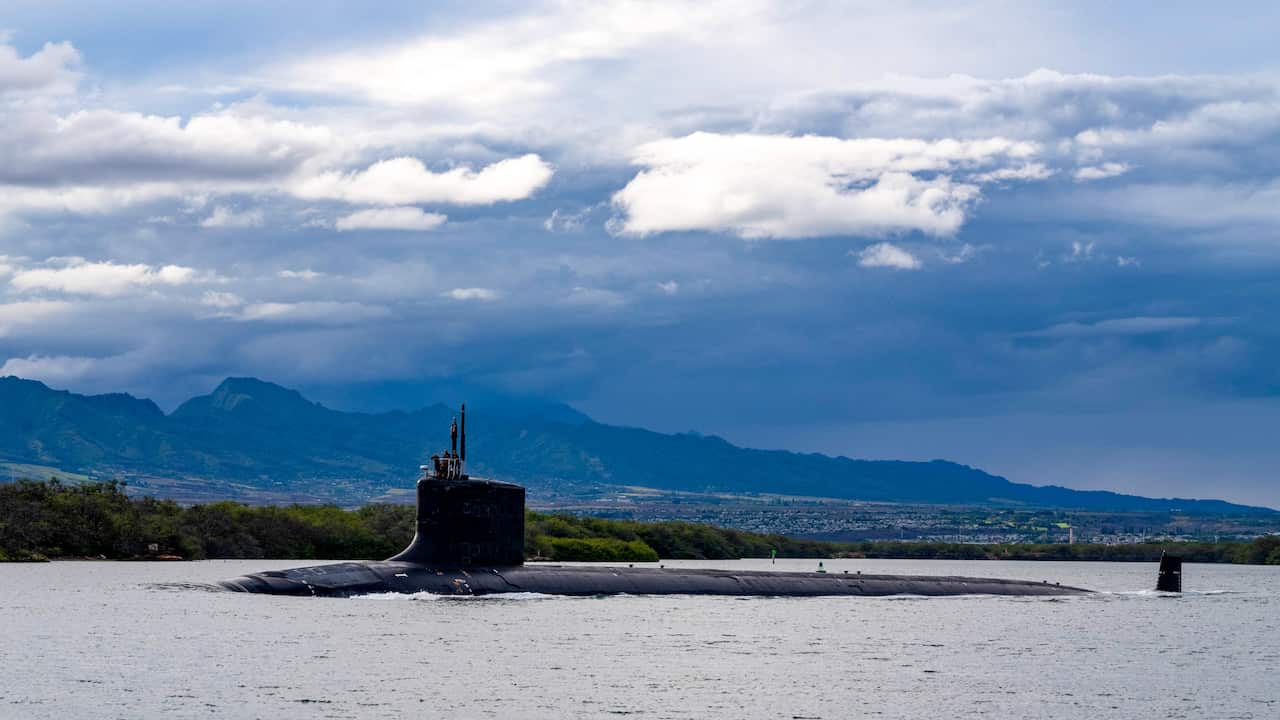 In this photo provided by U.S. Navy, the Virginia-class fast-attack submarine USS Missouri (SSN 780) departs Joint Base Pearl Harbor-Hickam for a scheduled deployment in the 7th Fleet area of responsibility, Sept. 1, 2021. Australia decided to invest in U