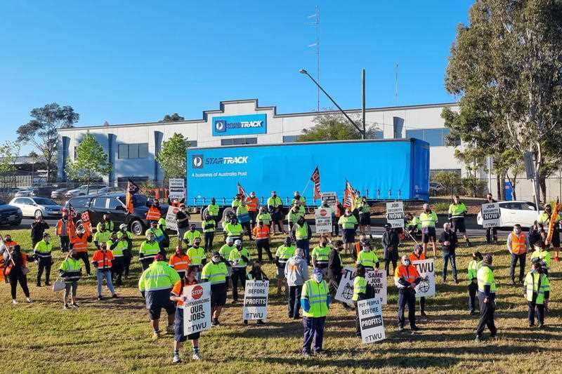 A supplied image obtained on Thursday, September 23, 2021, of StarTrack workers on strike in Sydney after crisis talks failed. Parcel deliveries across the country are being affected by a strike by up to 2000 StarTrack couriers who are in a dispute over p