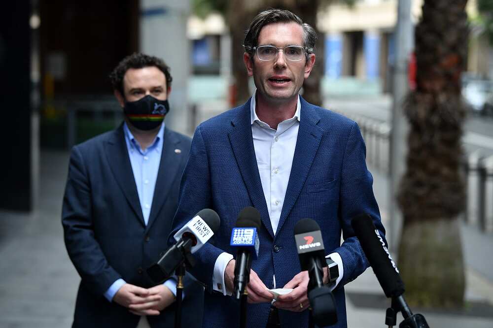 NSW Treasurer Dominic Perrottet and NSW Minister for Western Sydney Stuart Ayres speak to the media during a press conference in Sydney, Sunday, October 3, 2021. Dominic Perrottet will become the 46th premier of NSW after being named as successor to the d
