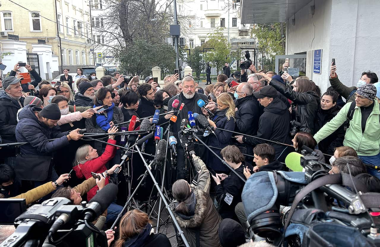 MOSCOW, RUSSIA - OCTOBER 8, 2021: Novaya Gazeta newspaper editor-in-chief Dmitry Muratov (C midground) talks to journalists. The 2021 Nobel Peace Prize has been awarded to Novaya Gazeta newspaper editor-in-chief Dmitry Muratov of Russia and Rappler CEO, j