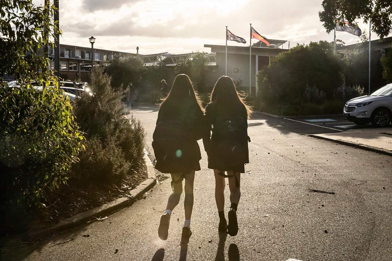Bentleigh Secondary College students are seen returning to school as COVID-19 restrictions are eased across Victoria, in Melbourne, Wednesday, July 28, 2021.  (AAP Image/Daniel Pockett) NO ARCHIVING