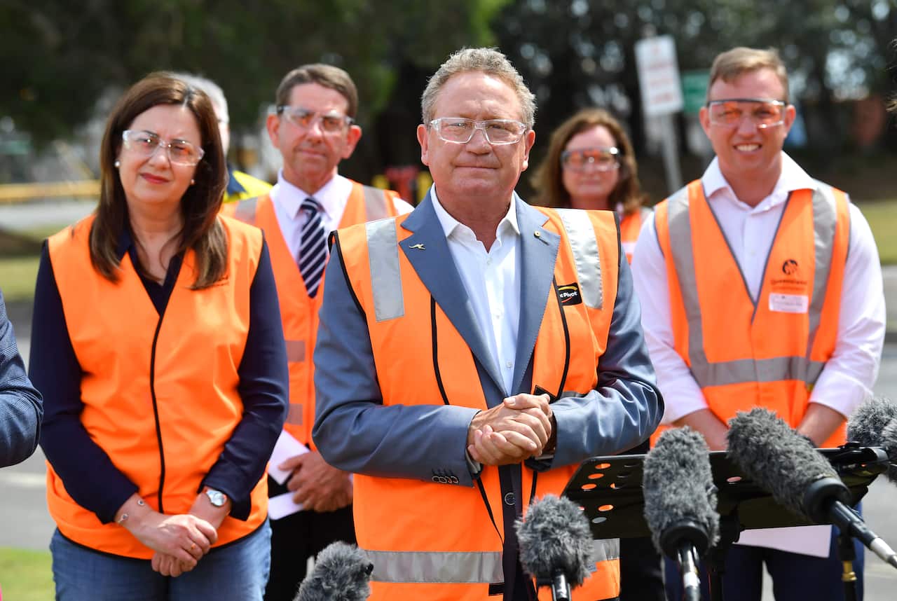 Andrew 'Twiggy' Forrest (centre) from Fortescue Future Industries is seen talking to the media as Queensland Premier Annastacia Palaszczuk (left) and Deputy Premier Steven Miles (right) looks on during a hydrogen announcement at Incitec Pivot on Gibson Is