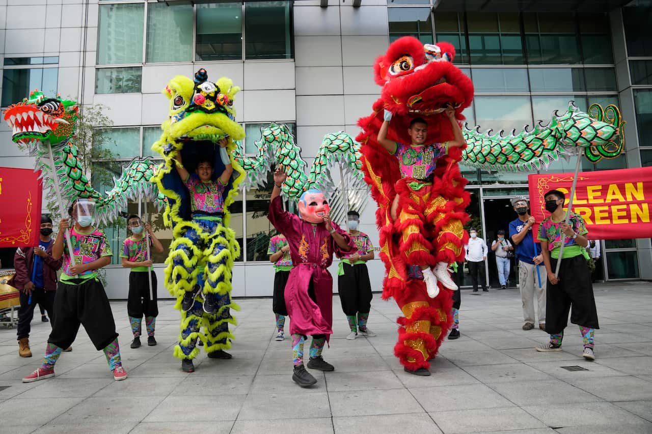 Dragon dancers perform during a rally outside the Chinese consulate in Makati, Philippines on Wednesday Oct. 27, 2021. The demonstration was held by Filipino climate activists ahead of the UN Climate Change Summit (COP26) in Glasgow, Scotland as the group