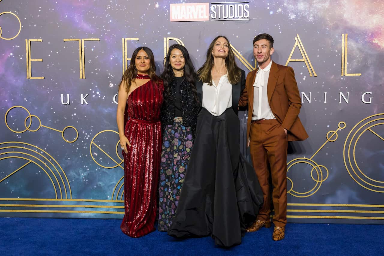 epa09549736 (L-R) Mexican-American actress Salma Hayek, Chinese director Chloe Zhao, US actress Angelina Jolie and Irish actor Barry Keoghan attend the UK premiere of 'Eternals' at the BFI Max in London, Britain, 27 October 2021. The movie will be release