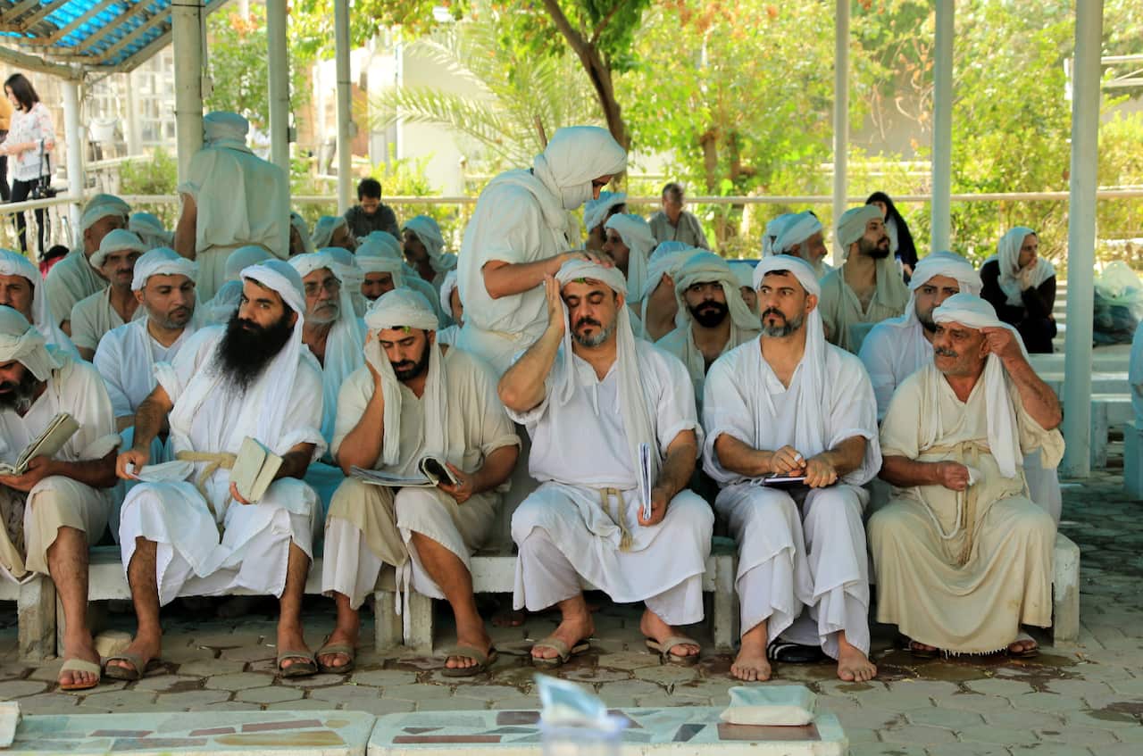 epa09557455 Followers of the Sabean-Mandaean community take part in a religious ritual marking the Eid Al-Ezdihar festival, on the banks of the Tigris river in central Baghdad, Iraq, 01 November 2021. The Eid Al-Ezdihar festival is a one-day religious hol