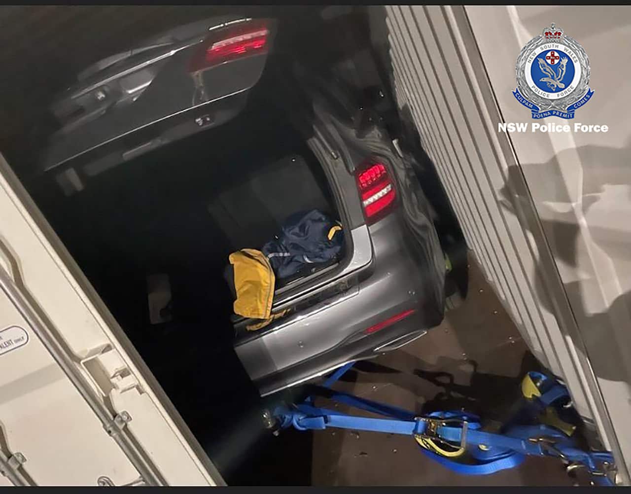 A supplied image shows a concealed vehicle that was being transported on a truck in Queensland, Wednesday, November 10, 2021. Police have arrested a wanted Northern Beaches man after he was located concealed in a vehicle being transported on a truck trave