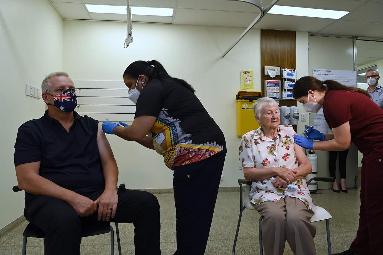 PM Morrison received his COVID-19 booster vaccination with elderly Jane Malysiak in NSW. 
