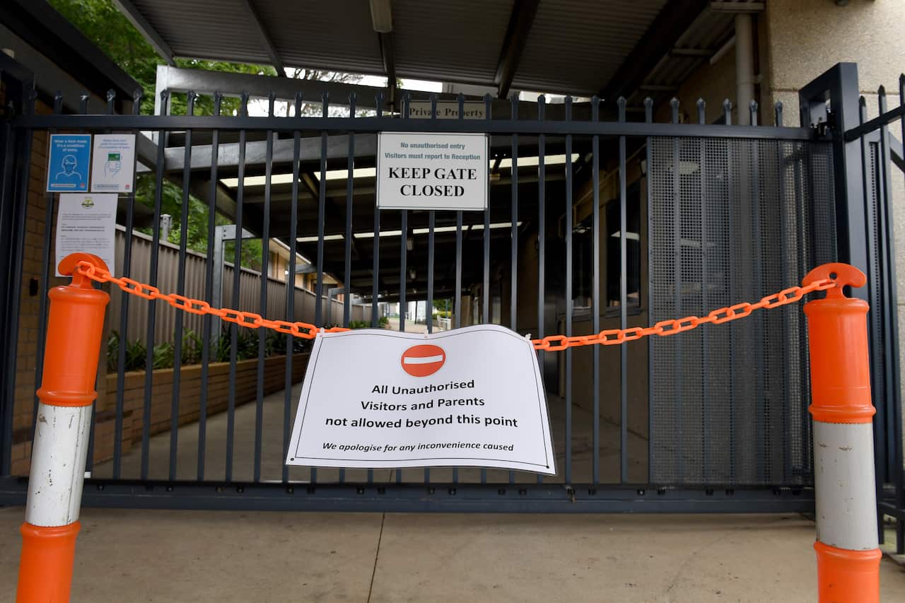 Signage is seen at Regents Park Christian School in Regents Park, Sydney, Saturday, December 4, 2021. NSW Health has confirmed 13 cases of COVID-19 at the school, with three cases confirmed as the Omicron variant. (