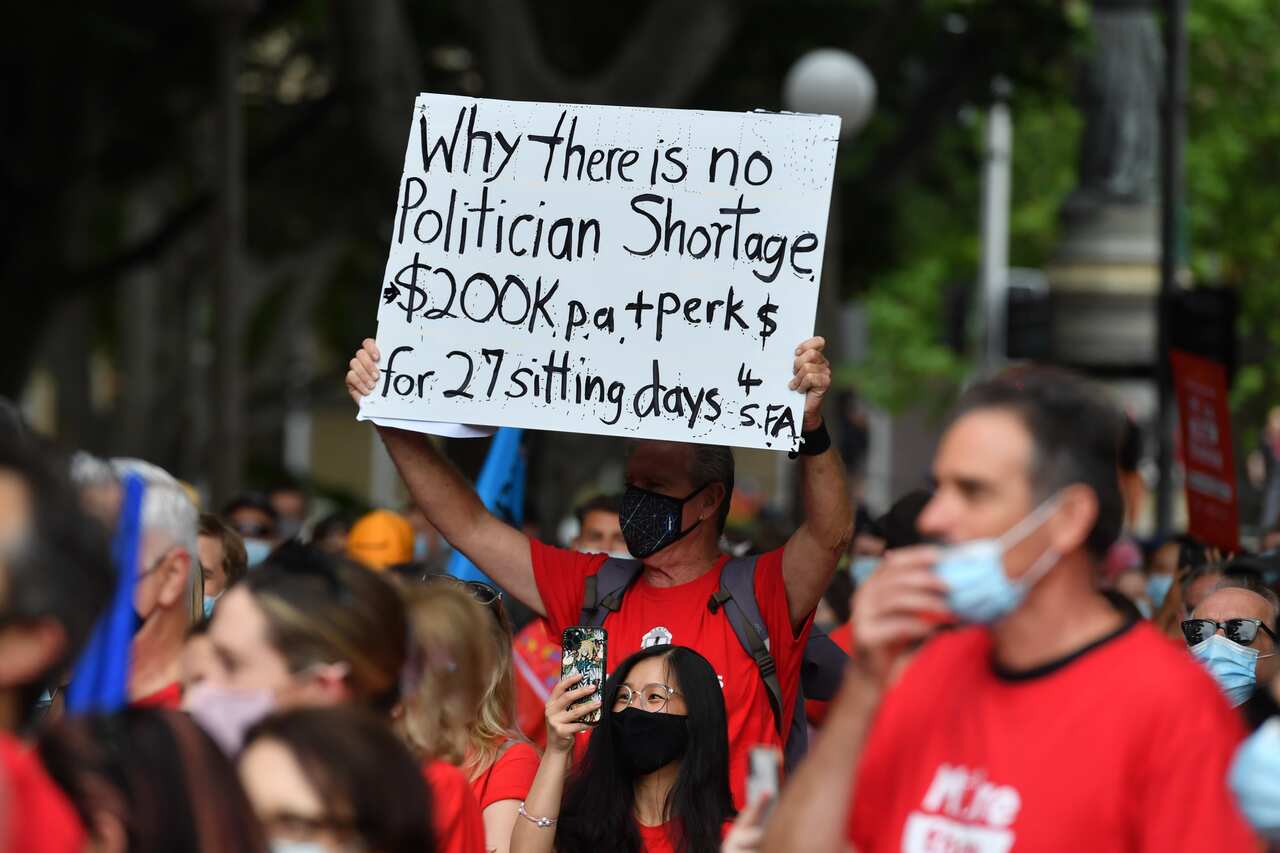 Teachers are seen in Hyde Park during a strike by NSW public school teachers and principals in Sydney, Tuesday, December 7, 2021. NSW teachers are stopping work over staff shortages and uncompetitive salaries.