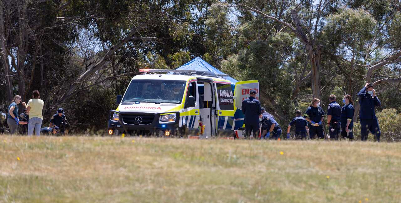 Emergency services personnel on scene  at Hillcrest Primary School in Devonport, Tasmania, Thursday, December 16, 2021. Several children have suffered serious injuries in northwest Tasmania after falling about 10 metres from a jumping castle that was blow