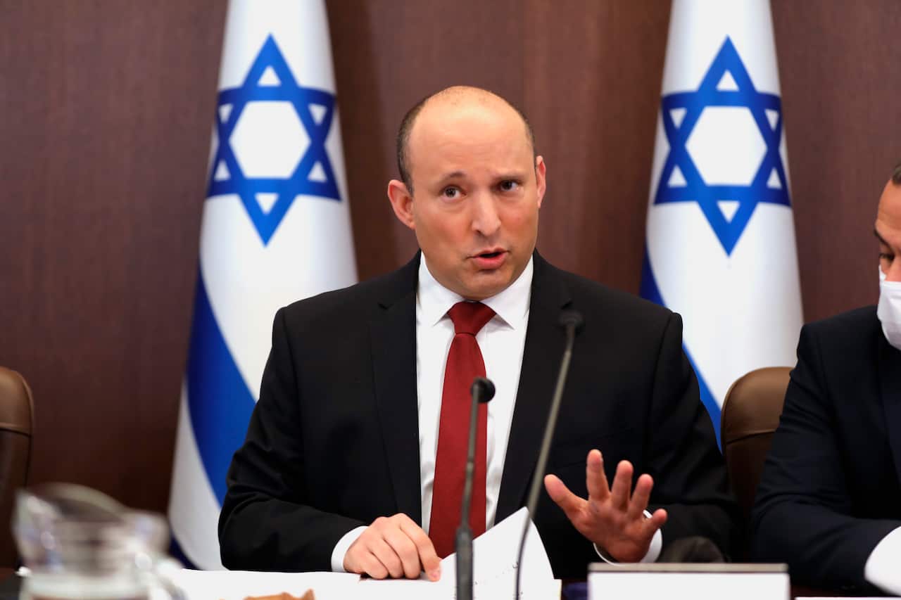 Israeli Prime Minister Naftali Bennett speaks during a cabinet meeting at the prime minister's office in Jerusalem, Israel, Sunday, Dec. 19, 2021. (Abir Sultan/Pool Photo via AP)