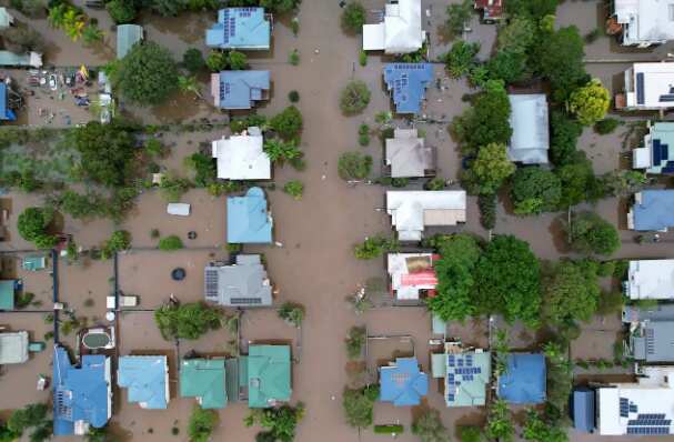 Houses are seen surrounded by floodwater on 31 March, 2022 in Lismore, NSW. 
