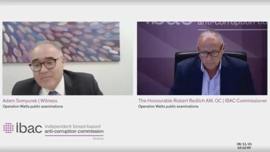 A screengrab of (L-R) witness Victorian MP Adem Somyurek and IBAC Commissioner Robert Redlich during a hearing