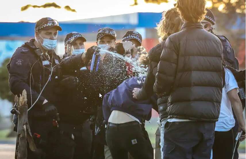 Protesters being pepper-sprayed by Victoria Police officers outside Melbourne Immigration Transit Accommodation (MITA ) in Broadmeadows.