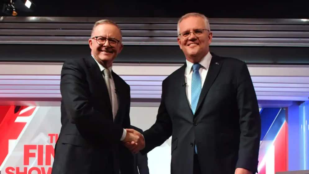 Prime Minister Scott Morrison (right) and Opposition Leader Anthony Albanese shake hands at the start of the final leaders' debate.
