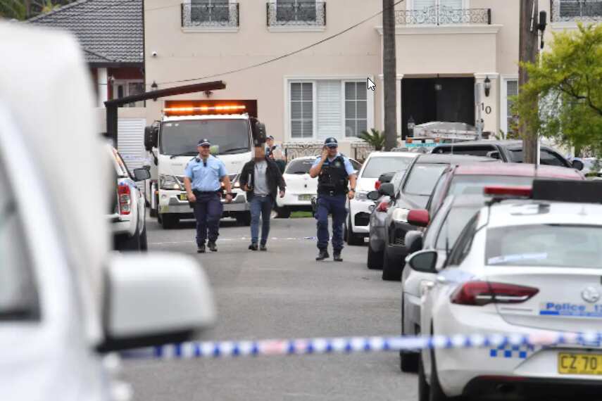 Police speak with residents at the scene of a shooting in Greenacre, Sydney, Thursday, 28 April, 2022
