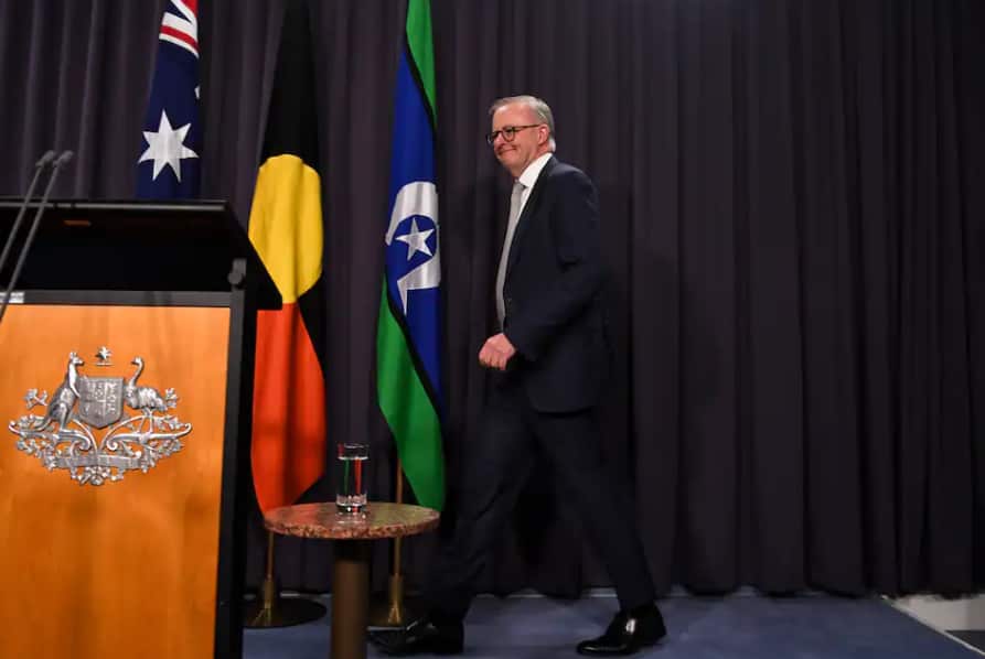 Anthony Albanese made his press conference debut as Prime Minister flanked by the Aboriginal and Torres Strait Islander flags. 
