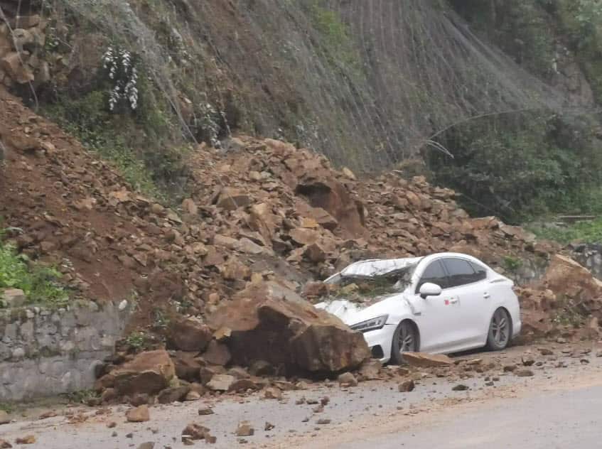 A car is buried in landslide rubble following an earthquake on 1 June, 2022 in Lushan County, Ya an City, Sichuan Province of China. A 6.1-magnitude earthquake jolted Lushan county on Wednesday afternoon.