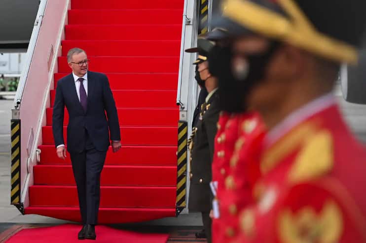 The prime minister is travelling with a large Australian delegation.