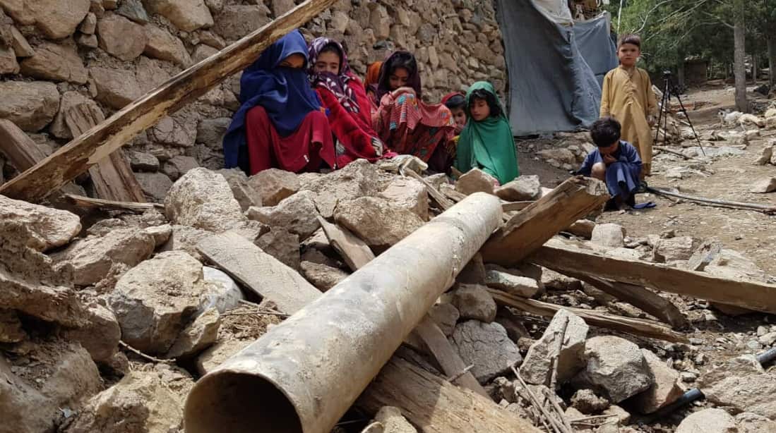 Afghan children are seen near debris after a magnitude 7.0 earthquake shook Afghanistan in June 2022.