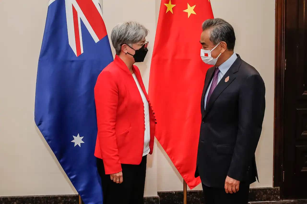 Australian Foreign Minister Penny Wong speaks with Chinese Foreign Minister Wang Yi at a bilateral meeting on the sidelines of the G20 summit in Bali on 8 July 2022.