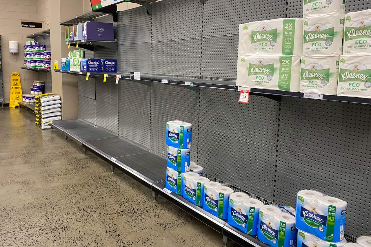 Empty shelves of toilet paper products