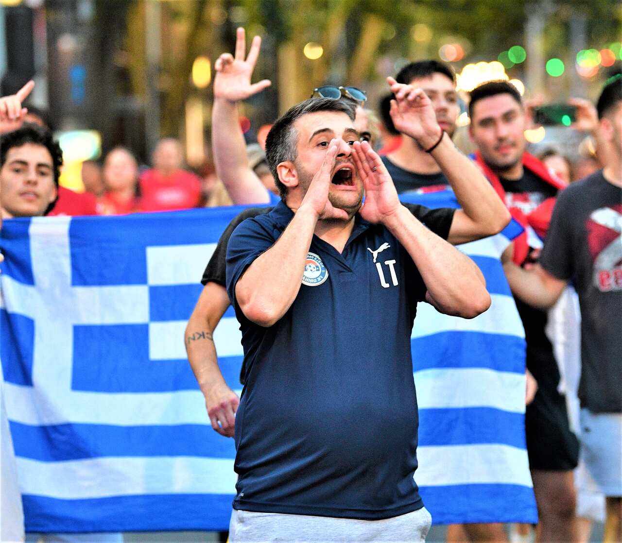 Members of the Serbian community taunt Victorian Police officers after they believed N Djokovic was taken away in a vechile from his lawyers office in Melbourne