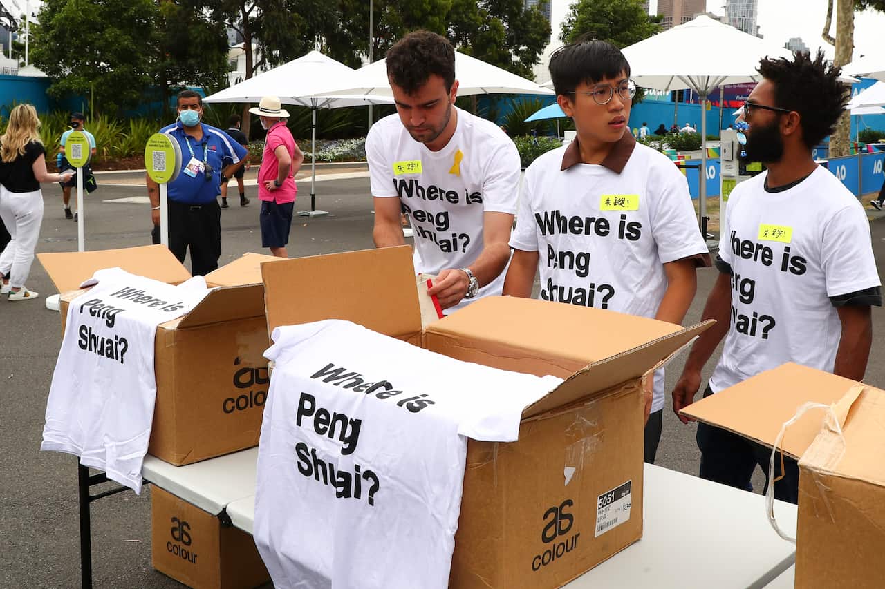 Activists hand out free 'Where is Peng Shuai?' T-shirts at the Australian Open. 