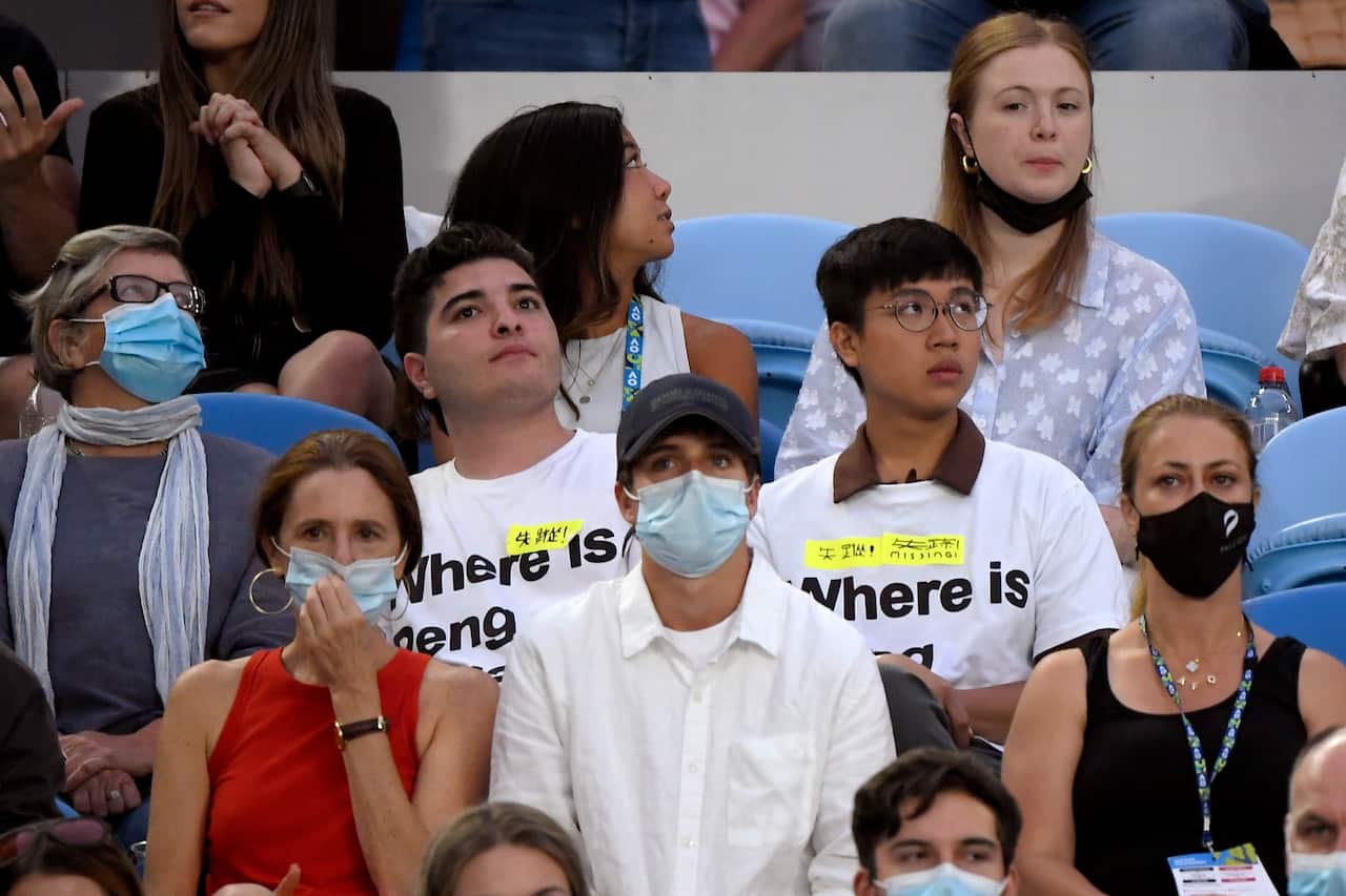 Protest organisers Drew Pavlou and Max Mok wearing Peng Shuai T-shirts at the women's final of the Australian Open.