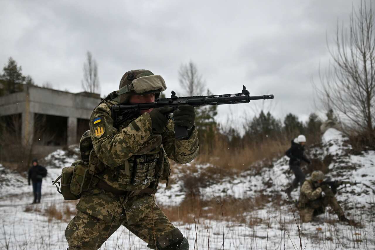 Ukrainian reservists practice combat movement drills.