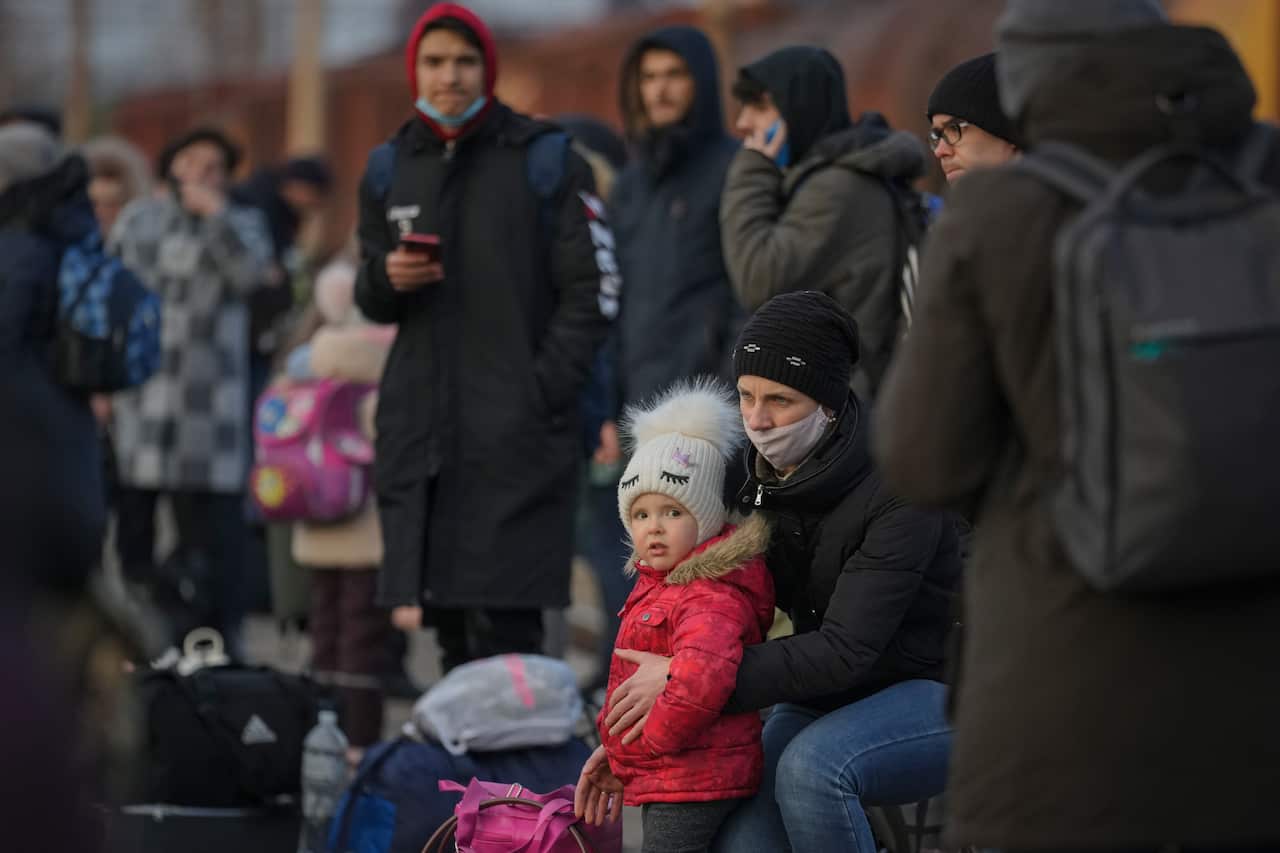 People waiting for a Kyiv bound train gather on the platform in Kramatorsk, the Donetsk region, eastern Ukraine.
