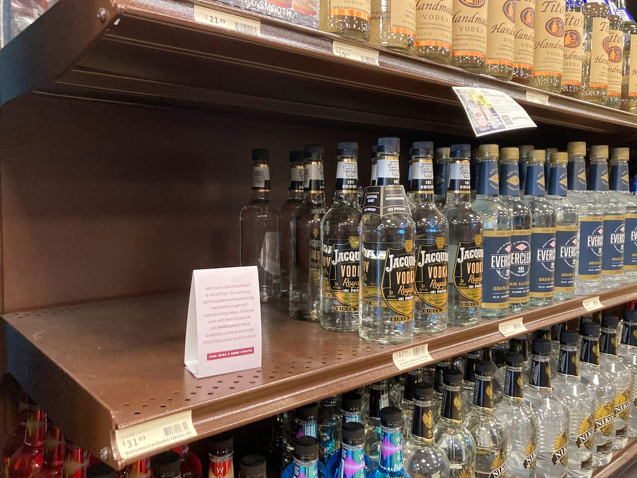 A shelf is emptied of Russian Standard Vodka at a Fine Wine & Good Spirits liquor store in Dresher, Pa., Monday, Feb. 28, 2022. Pennsylvania ordered the removal of Russian-made products from state-owned liquor stores. (AP Photo/Matt Rourke)