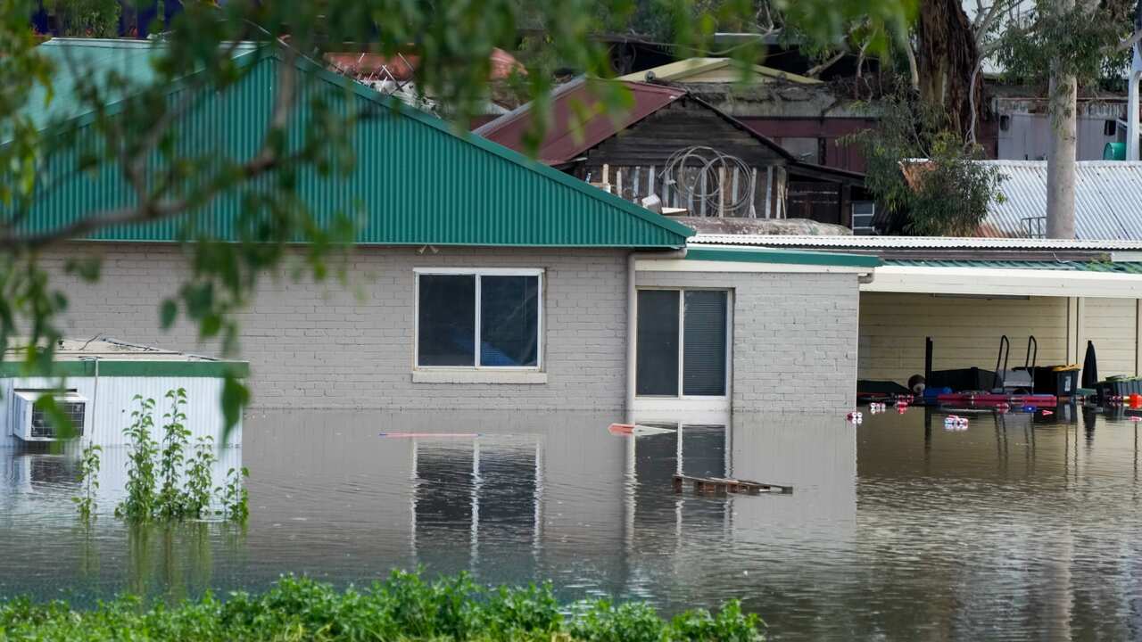 A building is surrounded by flood waters in Londonderry on the outskirts of Sydney, Australia, Thursday, March 3, 2022