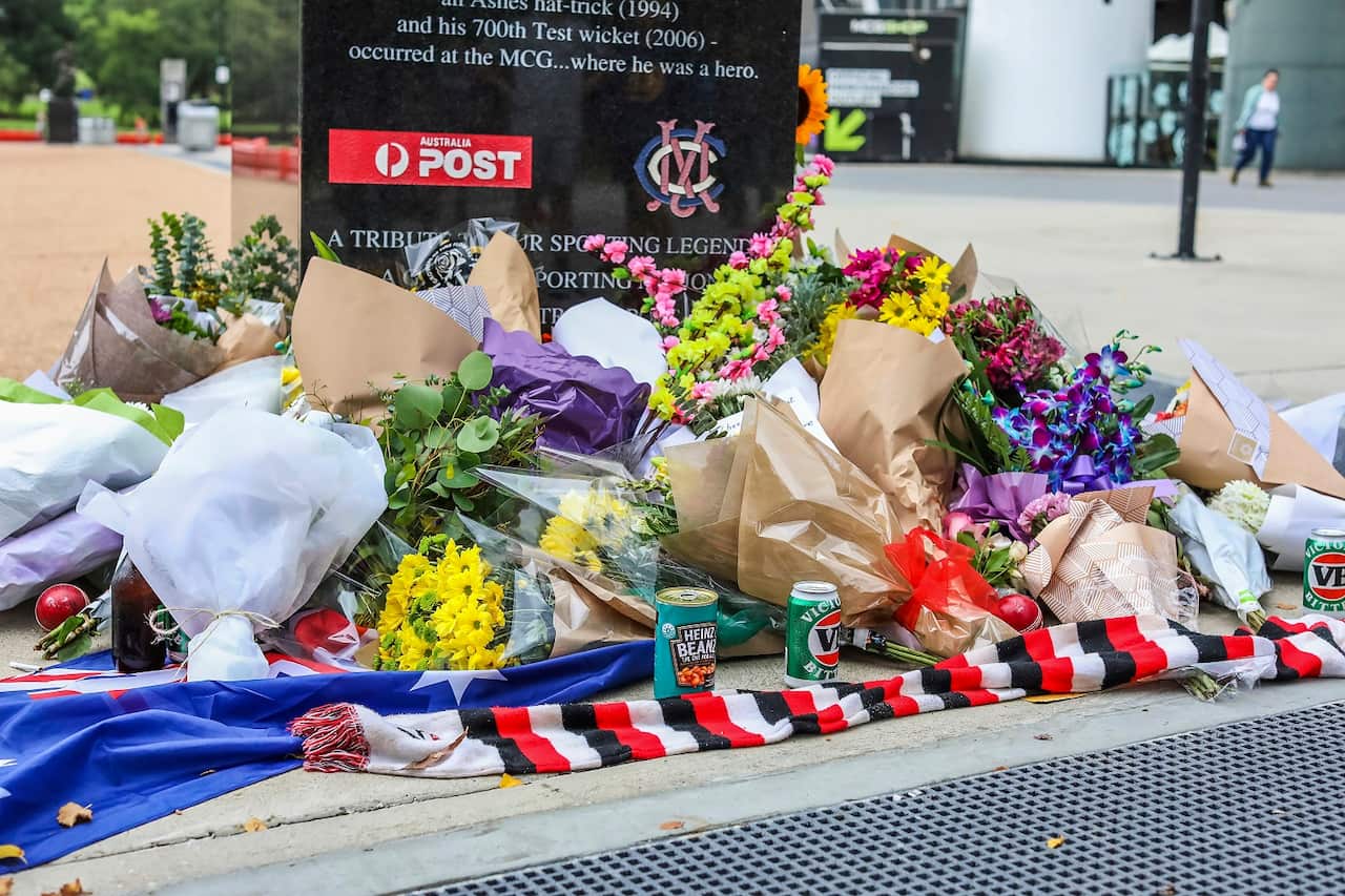 Flowers and tributes at the statue of Shane Warne outside the Melbourne Cricket Ground