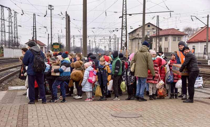 Evacuated children from an orphanage in Hulaipole at the train station in Lviv, western Ukraine