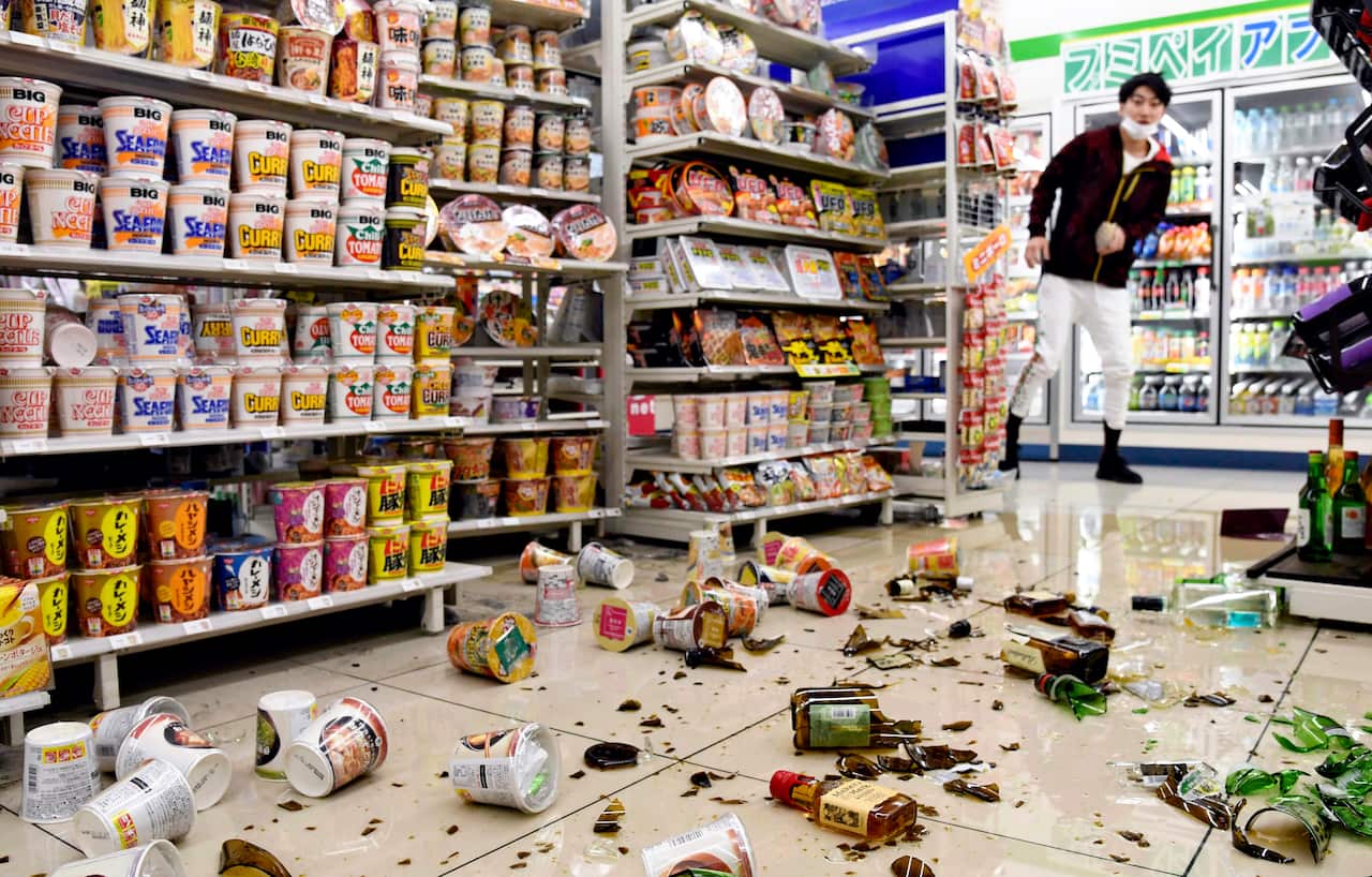 Bottles and other items that fell from shelves at a convenience store in Fukushima City when the earthquake hit.