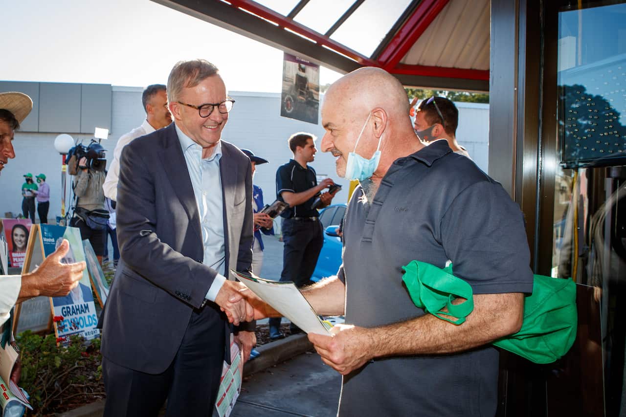 Federal Opposition Leader Anthony Albanese with SA Opposition Leader Peter Malinauskas during a visit to a pre-polling booth in Adelaide, Thursday, March 17, 2022.