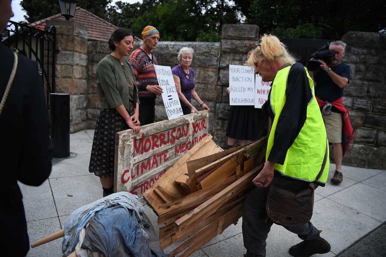 Flood effected residents of Lismore dump household flood damaged items outside the Prime Ministers residence of Kirribilli House in Sydney, Monday, March 21, 2022. (AAP Image/Dean Lewins) NO ARCHIVING