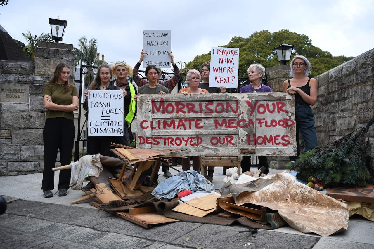 Flood effected residents of Lismore dump household flood damaged items outside the Prime Ministers residence of Kirribilli House in Sydney, Monday, March 21, 2022. (AAP Image/Dean Lewins) NO ARCHIVING