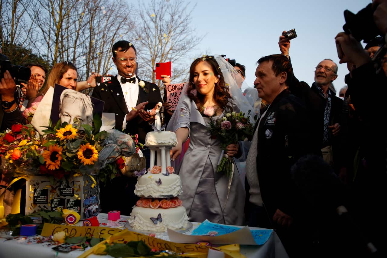 epa09844760 Stella Moris celebrates her wedding to Julian Assange outside HMP Belmarsh in London, Britain, 23 March 2022. British designer Vivienne Westwood designed Ms Moris's wedding dress and a kilt for Assange, whose parents are of Scottish extraction